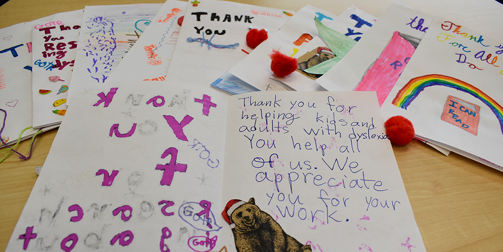 Thank you cards written by students thanking educators for helping them learn to read
