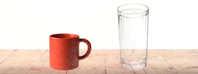 Red mug and clear glass of water side by side