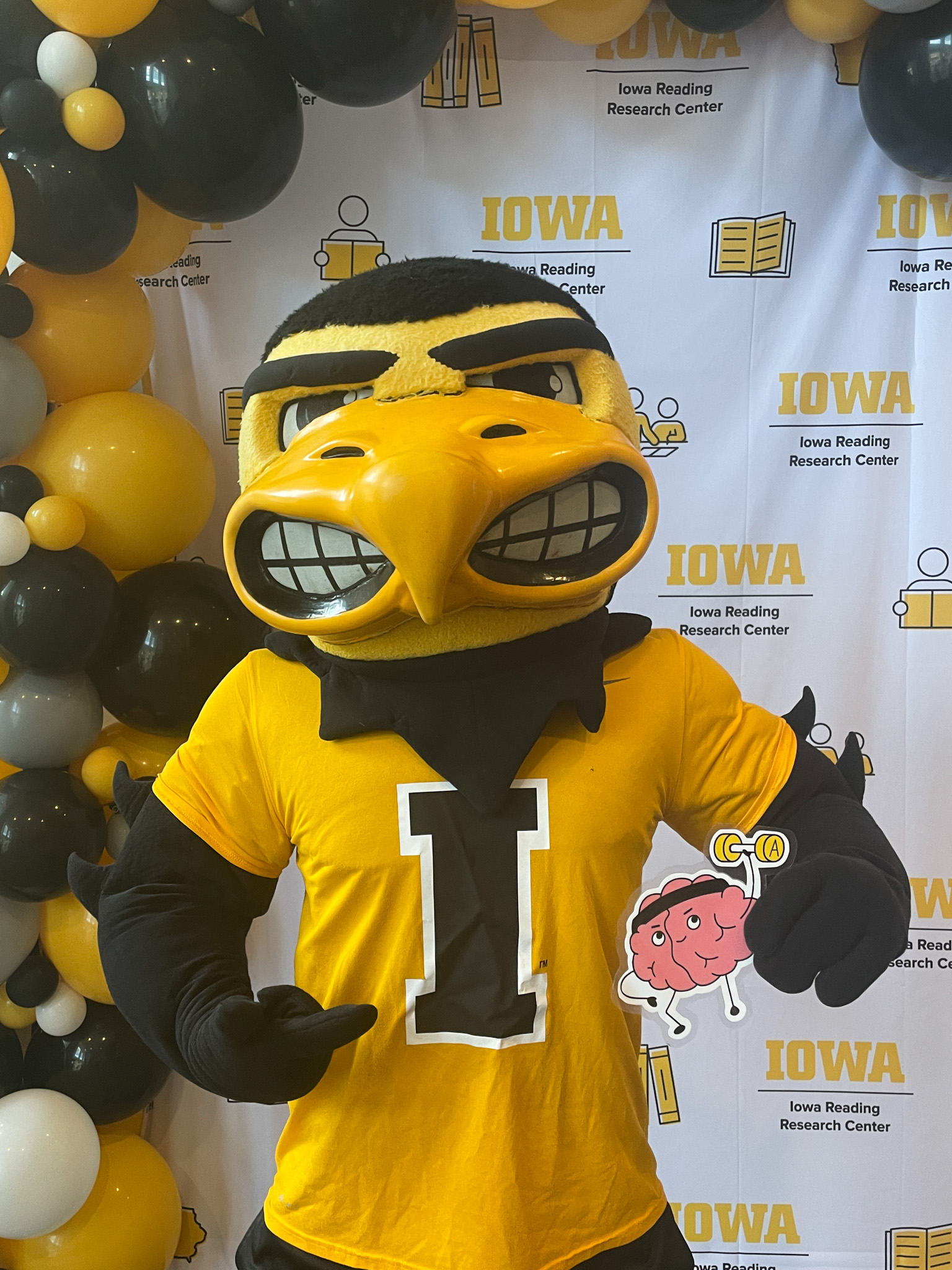 Herky holds Lifty, the LIFTER mascot