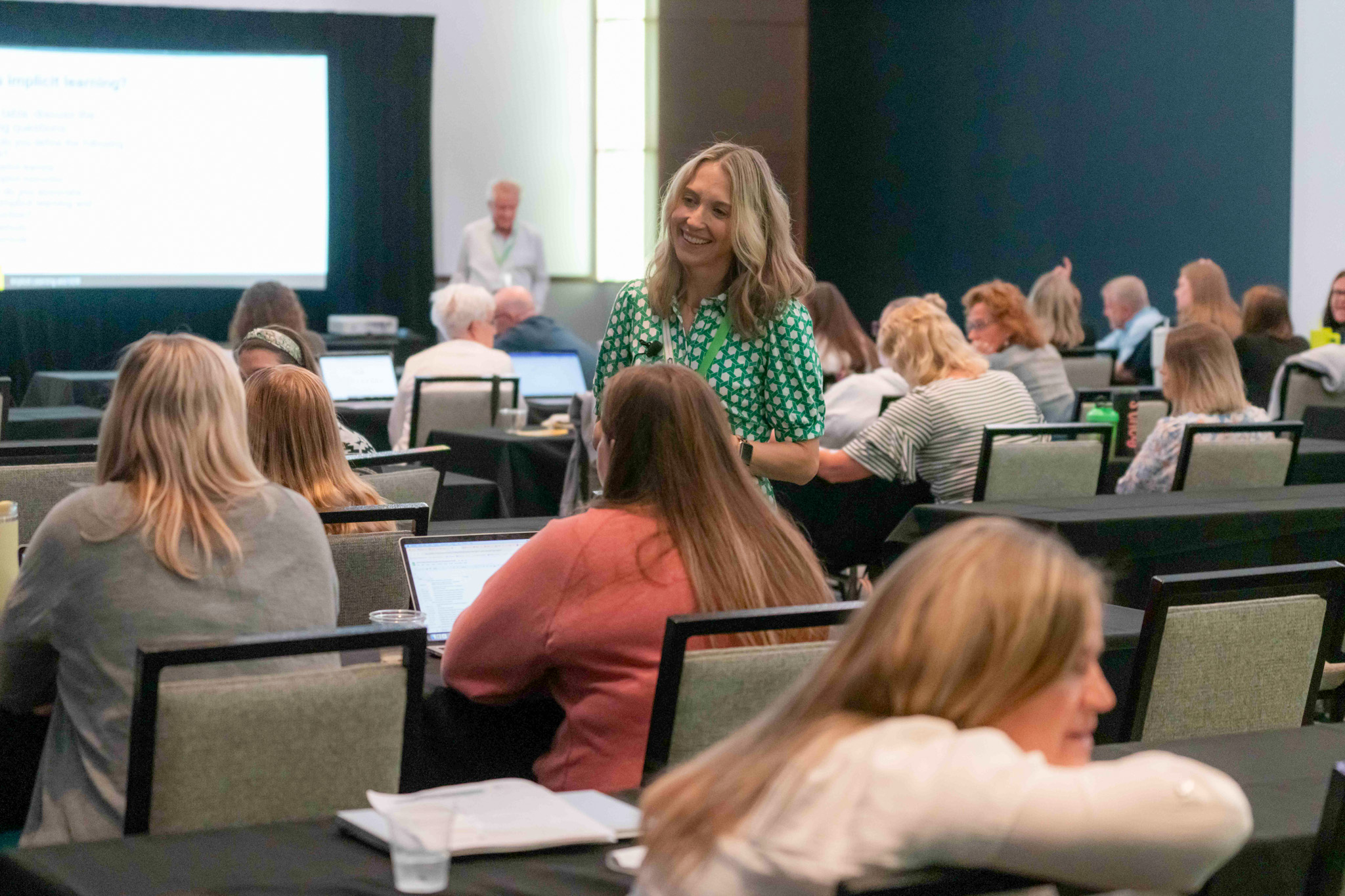 Leah Zimmermann speaks with Summit attendees during her presentation