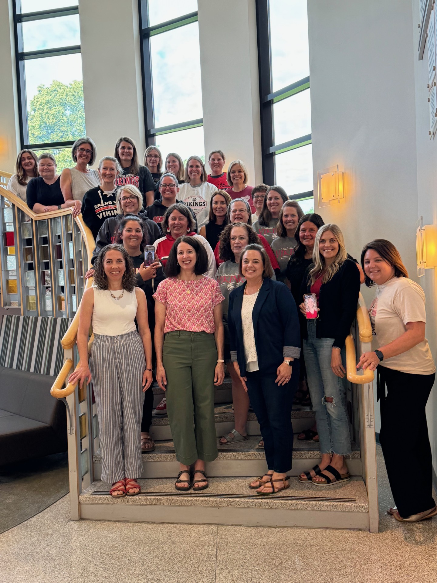 The Grandview DSE cohort smiles from a staircase