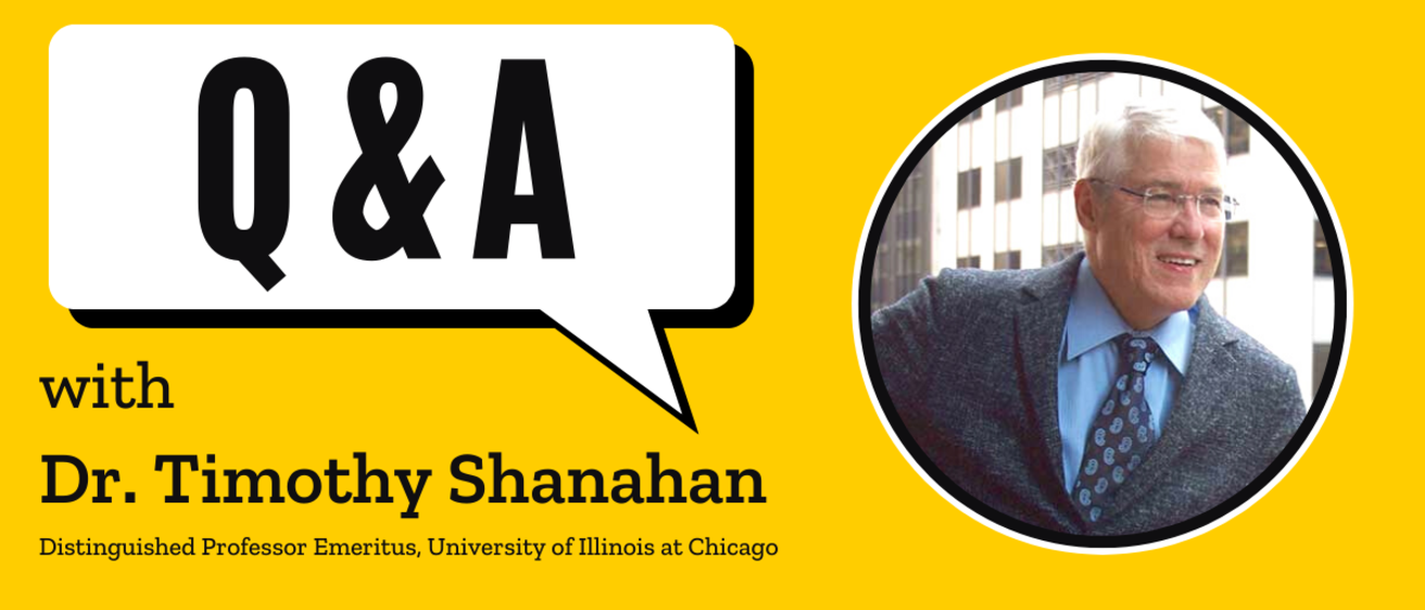 A speech bubble on a gold background reading "Q&A," below which is the text "with Timothy Shanahan." Pictured is a smiling man with white hair and glasses.
