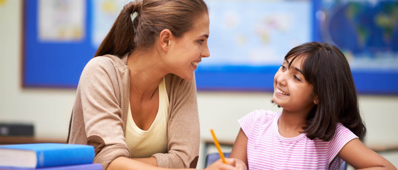 teacher talks with her student