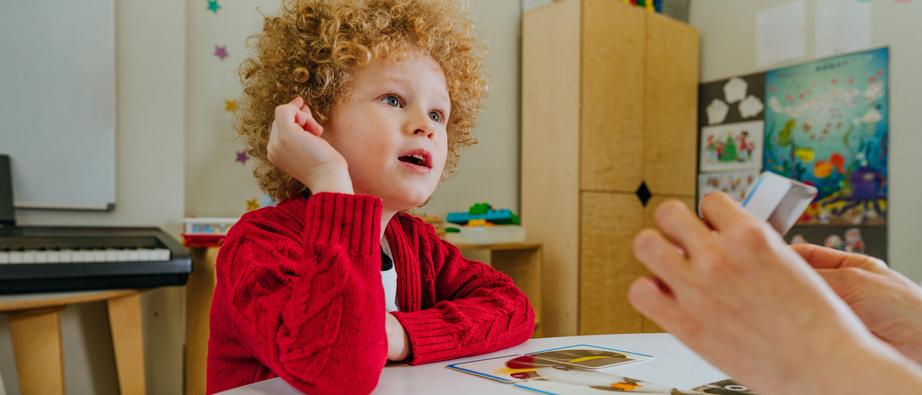 child works on flashcards