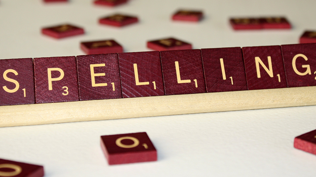 Scrabble blocks placed in order to spell "Spelling"