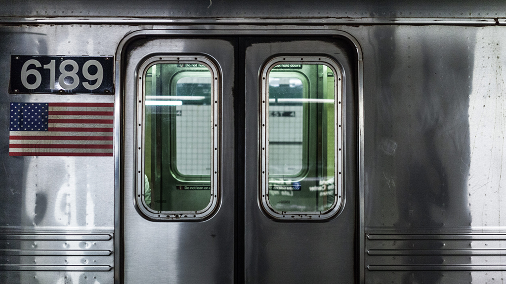 Silver subway train door closed