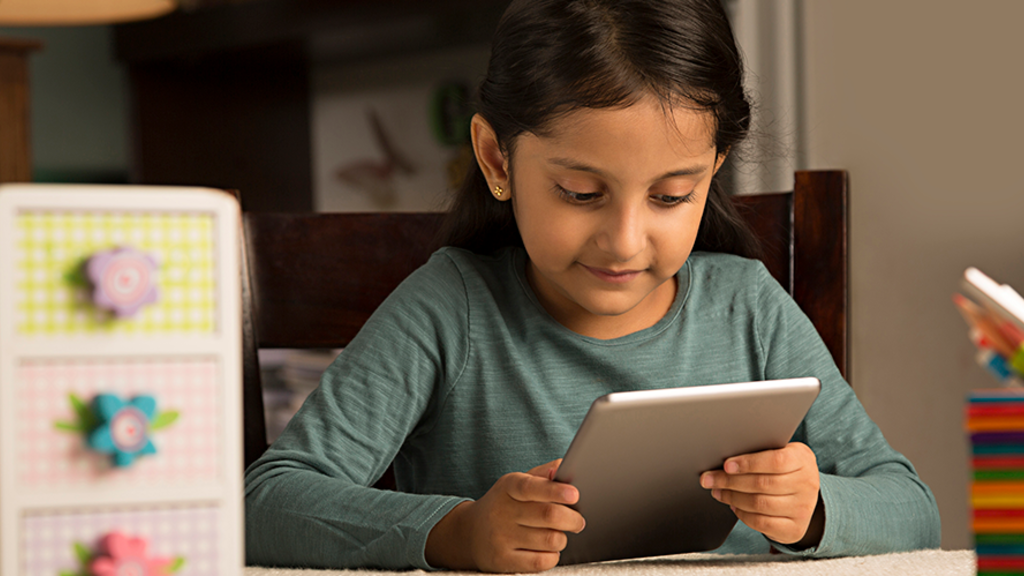 Girl reading on tablet