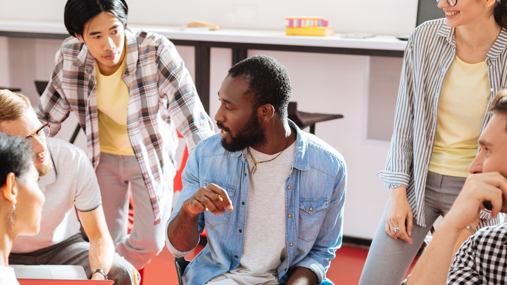 A group of teachers sitting discussing something together