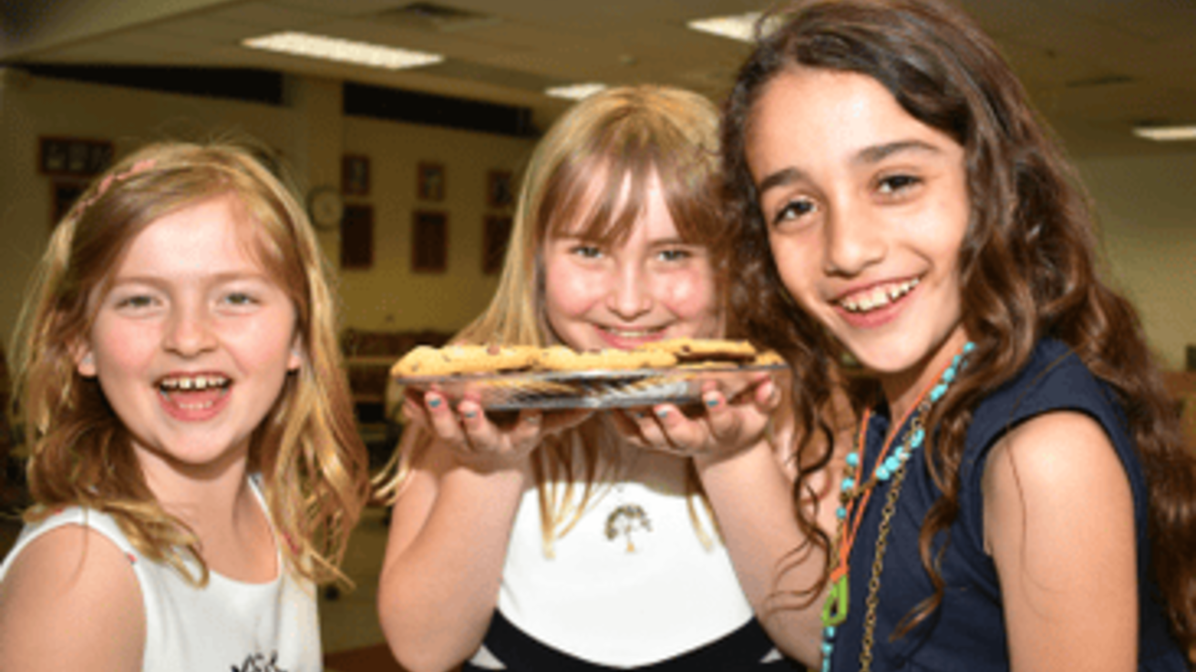 Sophie, Grace, and Talen with cookies